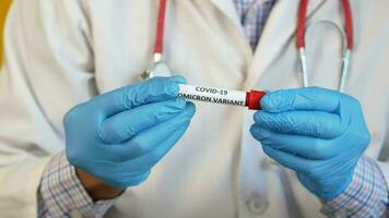 hand hold omicron variant corona virus blood test tube video