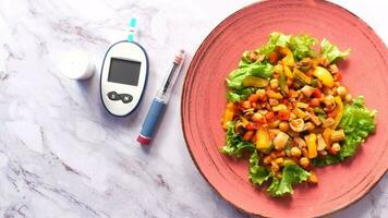 Diabetic measurement tools and insulin pen and healthy food on table video