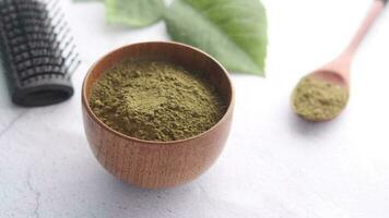 The wooden bowl with rehydrated henna on table video