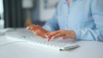 Woman typing on a computer keyboard at home office, monitor with a green screen. Chroma key. Copy Space. Concept of remote work. video