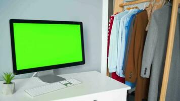 Woman typing on a computer keyboard at home office, monitor with a green screen. Chroma key. Copy Space. Concept of remote work. video