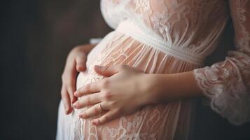 a pregnant lady holds her hands on her stomach, close-up center on her stomach, bokeh is obscured from behind a children's room. photo