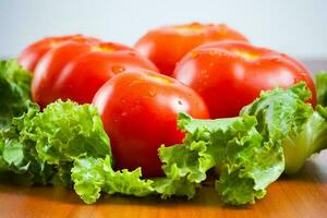 Fresh red tomatoes close-up photo