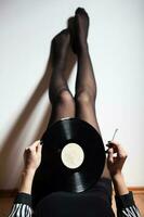 Legs with vinyl record photo