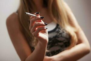 Woman smoking close-up photo