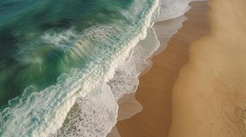 Airborne see of sandy shoreline with waves and clear sea water. photo