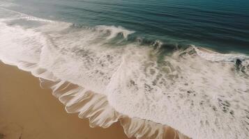 Airborne see of sandy shoreline with waves and clear sea water. photo