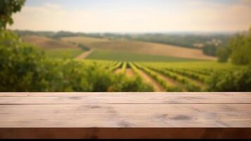 A French vineyard serves as the clouded foundation for an cleanse wooden table. Creative resource, photo