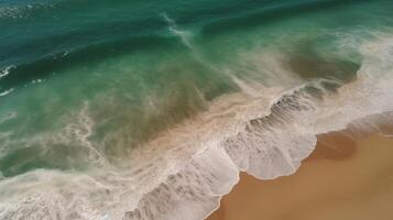 Airborne see of sandy shoreline with waves and clear sea water. photo