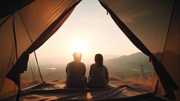 Man and Plenteous lady couple appreciate in they tent at they camping point with morning to begin with light see. Creative resource, photo