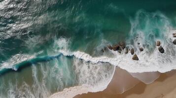 Airborne see of sandy shoreline with waves and clear sea water. photo