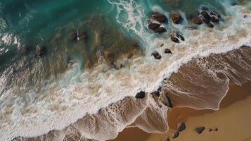 Airborne see of sandy shoreline with waves and clear sea water. photo