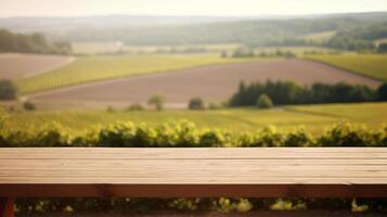 A French vineyard serves as the clouded foundation for an cleanse wooden table. Creative resource, photo