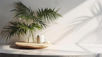 Detached beige cotton tablecloth on counter table, tropical dracaena tree in daylight on white divider foundation. photo
