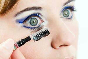 Woman getting her make-up done photo