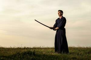 Kendo fighter holding bokuto photo