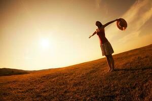 Woman with open arms outdoors photo