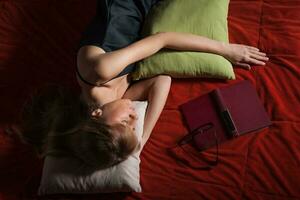 Woman laying on the bed photo