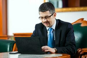 Businessman working at his office photo