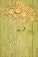 Organic pasta on wooden board photo