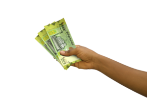 Fair hand holding 3D rendered Yemeni rial notes isolated on transparent background png