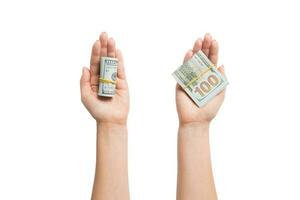 Top view of dollar bills in tubes in female hands on white isolated background. Business concept photo