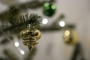 Christmas tree toys on spruce branches, Merry Christmas and Happy New Year photo