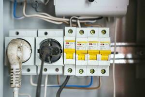 electrical panel with sockets and circuit breakers with wires photo