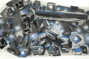 removed buttons of the keyboard sink with soap solution photo