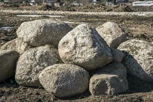 a pile of boulders on the site for the construction photo