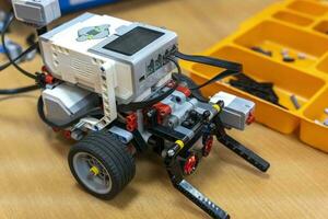 programmable children's robot assembled from designer parts photo