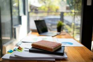 Businesswoman hands working on stacks of paper documents to search and review documents piled on table before sending them to board of directors to use  correct documents in meeting with Businessman photo