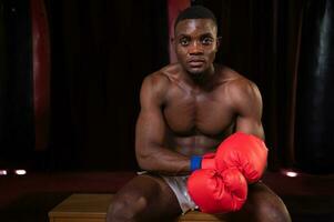 Portrait of boxer preparing to fight on stage to gain experience in the use of Muay Thai martial arts photo