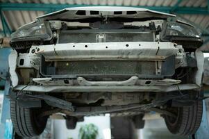 The engine of a car that has been hit hard. Professional technicians repair until it is in normal working condition. photo