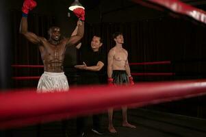 Victorious boxer the referee will raise their hands on stage, Muay Thai, Thai martial arts. photo