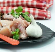 Raw chicken with the ingredients for the dishes photo