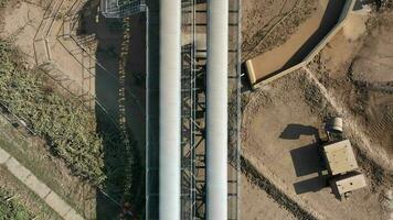 Tipper Trucks Receiving Earth from a Digger and Conveyor video