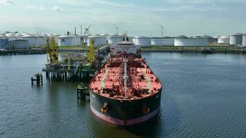 Crude Oil Liquid Cargo Transporter Ship Unloading Petrochemicals to a Fuel Depot video