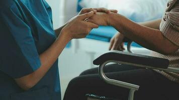 young asian physical therapist working with senior woman on walking with a walker video