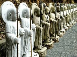 Closeup and perspective view of Japanese buddha statues photo