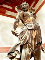 Closeup japanese giant guarding front of the japanese temple gate. photo