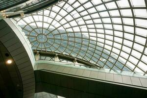 Building roof and glass ceiling of modern building. Roof and glass ceiling helping to light the building and reduce energy and It also the air to be poured easily. photo