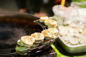 Fried Chinese steamed chives dumplings. Chinese steamed chives dumplings is Chinese snack by the flour is made from rice flour mixed with tapioca starch and filling is made of garlic chives. photo