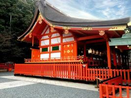 Red hall of Japanese temple at Fushimi Inari Shrine in Kyoto, Japan photo