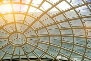 Building roof and glass ceiling of modern building. Roof and glass ceiling helping to light the building and reduce energy and It also the air to be poured easily. photo