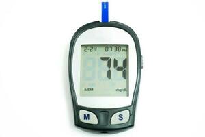 Top view glucose meter machine and numbers of glucose in the blood show on screen with sheet check isolate on white background and make with paths. photo