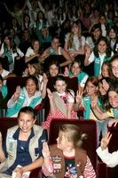 Abigail Breslin after her induction into the Girl Scouts of the USAwith her fellow Girl ScoutsZanuck Theater20th Century Fox LotCentury City CA  March 26 20082008 photo