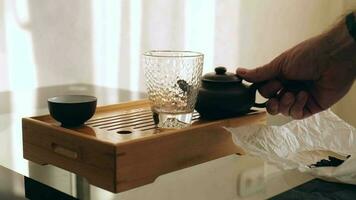 man pouring pu-erh tea into chahay video