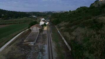 Traveling Train In The Quiet Medieval Town Village Of Obidos, Leiria-Portugal. - Aerial Pullback Shot video