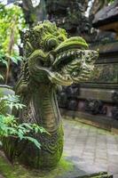 Traditional balinese statue dragon. Ubud photo